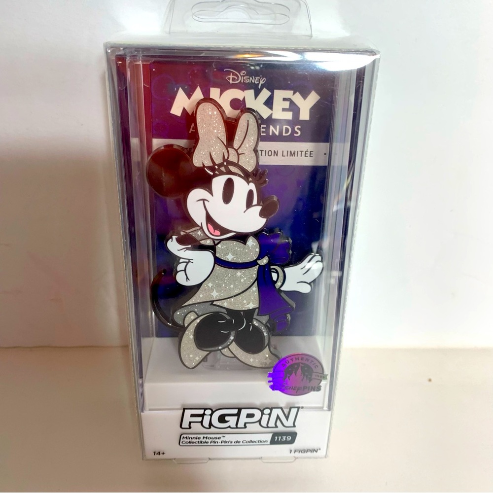 NWT. Disney Minnie Mouse FiGPiN collectible pin
Minnie wears a glittering  dress